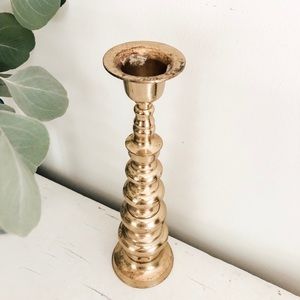 Medium to large sized brass candle stick holder. Top is a little loose.